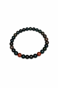 Beaded stretch bracelet with dark green and black beads and a red stone detail