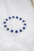 Beaded stretch bracelet with alternating blue lapis lazuli and white howlite beads