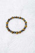 Hematite beaded stretch bracelet with dark and brown/gold round beads