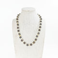 Beaded crystal stretch necklace on mannequin, dark round beads with yellow citrine accents
