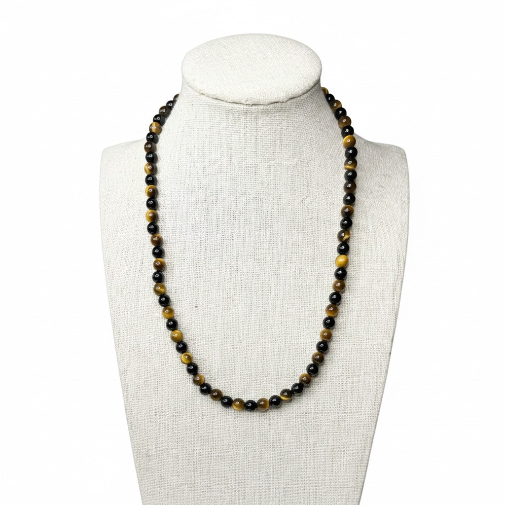 Black onyx beaded stretch necklace with dark beads and small gold-tone accents