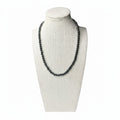 Hematite beaded stretch necklace on mannequin, dark gray round beads