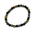 Black onyx, tiger eye, and hematite beaded stretch bracelet with silver-toned spacers