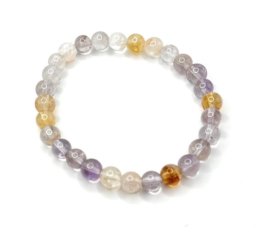 Stretch beaded bracelet with clear, lavender, and honey amber round stones