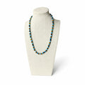 Apatite beaded stretch necklace on display stand, blue and brown bead strand.