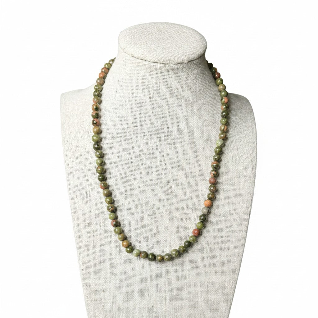 Unakite beaded stretch necklace with green and orange oval beads on curved strand