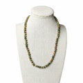 Unakite beaded stretch necklace with green and orange oval beads on curved strand