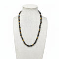 Beaded stretch necklace with round black stones and gold tiger-eye accents