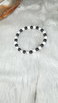 Matte white howlite and hematite beaded stretch bracelet with black and white beads
