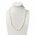 White howlite and yellow citrine beaded stretch necklace on mannequin