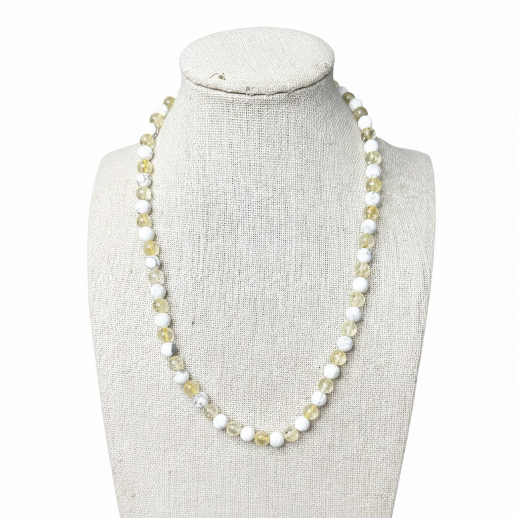 White howlite and yellow citrine beaded stretch necklace on mannequin