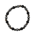 Beaded stretch bracelet with glossy black beads and bronze-gray stone accents